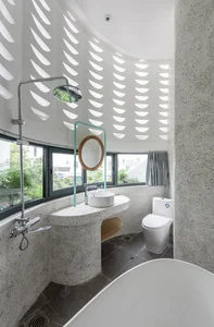 Modern Tube House Design: Open Concept Featuring Unique Fish Scale Ventilation Bricks - image 2