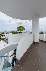 Modern Tube House Design: Open Concept Featuring Unique Fish Scale Ventilation Bricks - image 11
