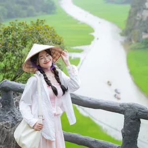 Admire the Breathtaking Beauty of Tam Coc During the Vibrant Green Rice Season - image 1