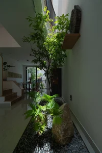 Modern Three-Story House with Traditional Red Tile Roof Design - image 3