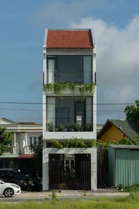 Modern Three-Story House with Traditional Red Tile Roof Design - image 5
