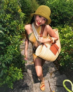 Vietnamese Celebrities Rocking the Luxury Straw Bag Trend - image 9