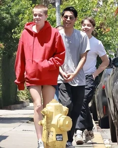 Shiloh Jolie-Pitt Rocking Bold Pink Buzz Cut Fashion - image 3