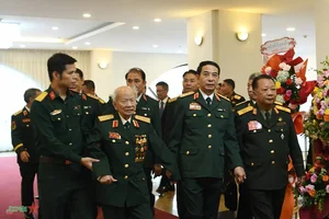 Commemorating the Traditional Day of Vietnamese Volunteer Soldiers and Experts in Laos - image 0