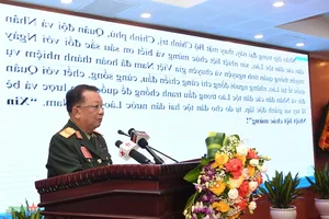 Commemorating the Traditional Day of Vietnamese Volunteer Soldiers and Experts in Laos - image 4
