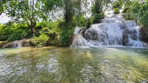 Escaping the Heat: Discover the Serene Beauty of Thac May Waterfall - image 6