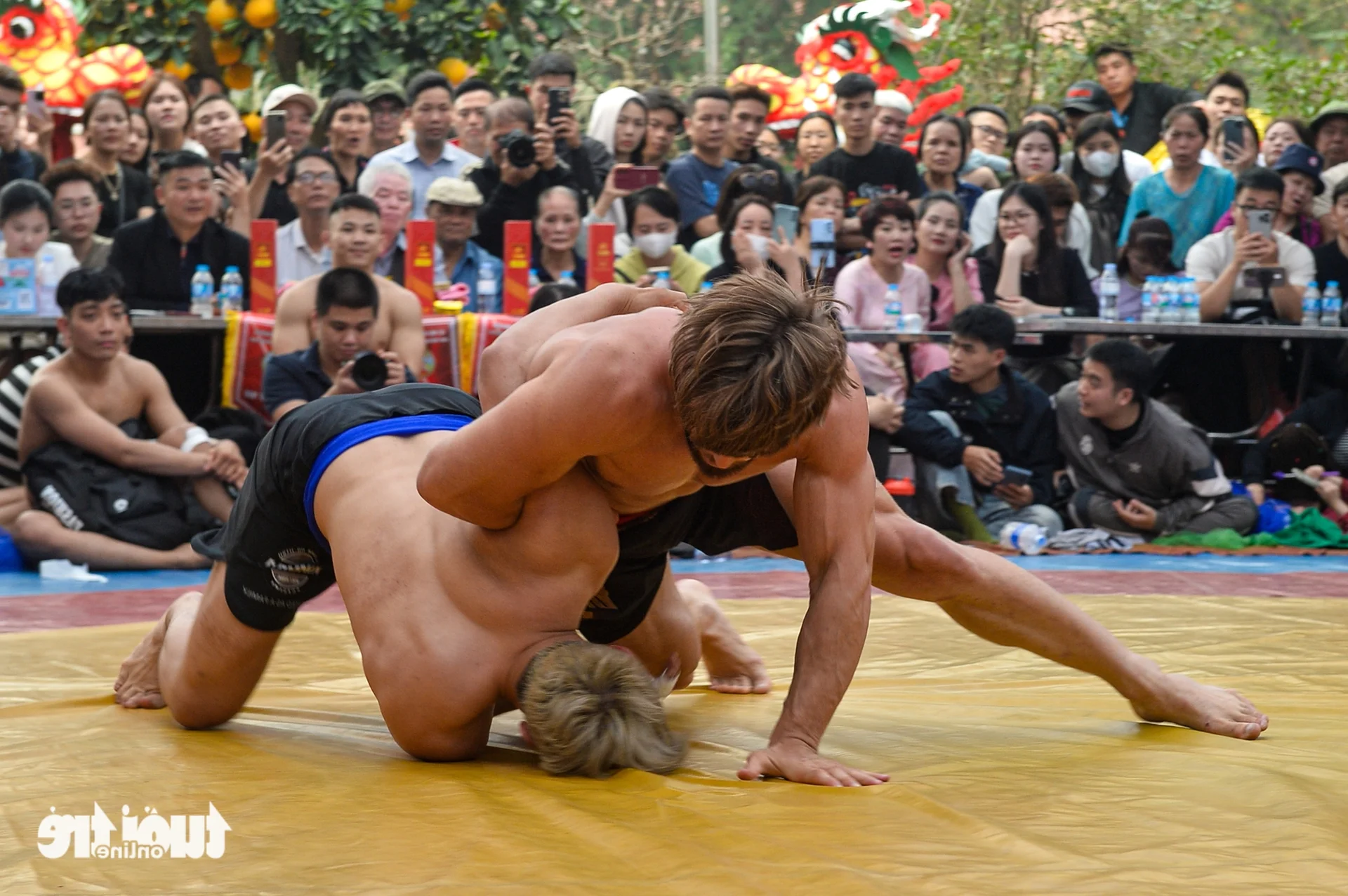 International Belarusian Wrestler Captivates Local Crowds at Traditional Hanoi Village Wrestling Festival