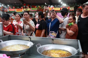 Crowds Gather at Ancient Chinese Pagoda for Famous Golden Tofu - image 7