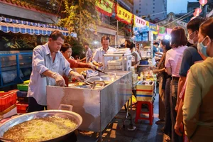 Crowds Gather at Ancient Chinese Pagoda for Famous Golden Tofu - image 0