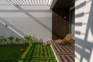 Modern 2-Story House Design Featuring Central Courtyard and Raw Concrete - image 6
