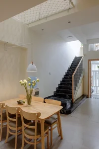 Optimizing Light and Space: A 65m2 Split-Level House Design in a Narrow Urban Alley - image 4